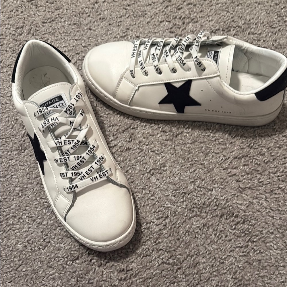 White Sneakers with Black Star Accent